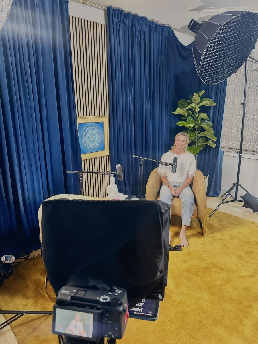 Studio podcast set with blue curtains
